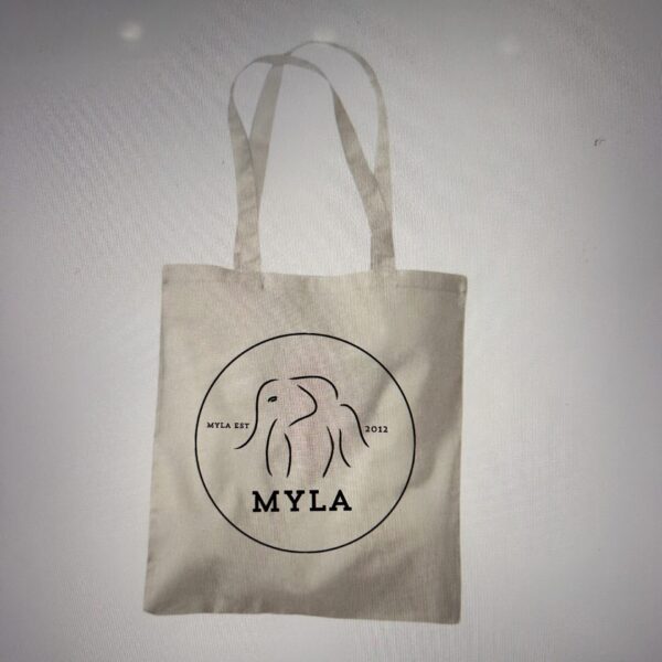 Beige tote bag with 'MYLA' logo on a light grey background
