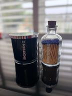 Black and blue candle and match bottle set with "Thirteen" personalised in white lettering.
