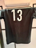 Black event t-shirt with the number 13 on the back in white
