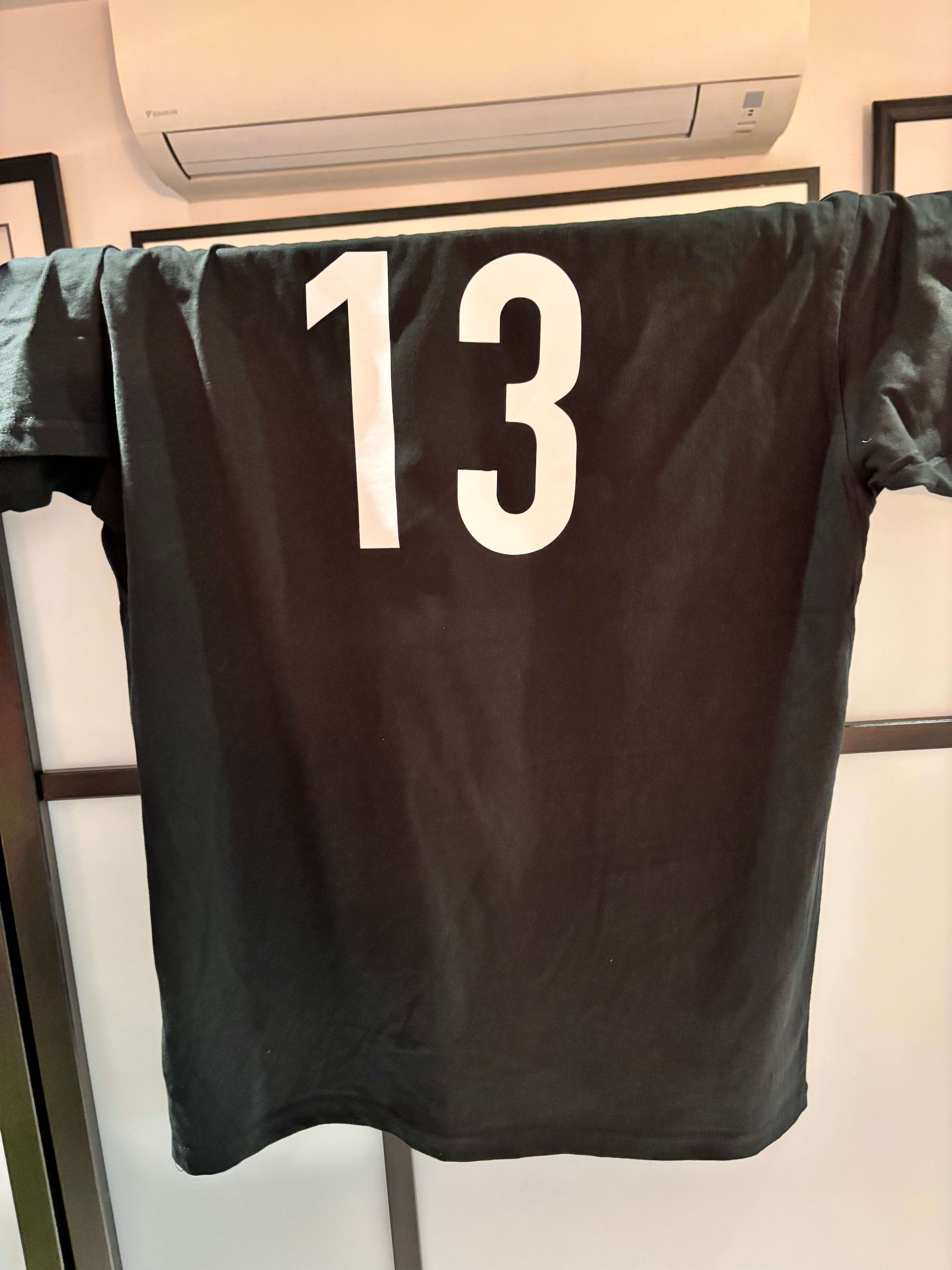 Black event t-shirt with the number 13 on the back in white