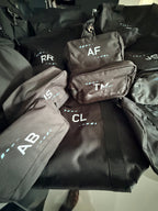 Black sports duffel bag with personalised name initials in white
