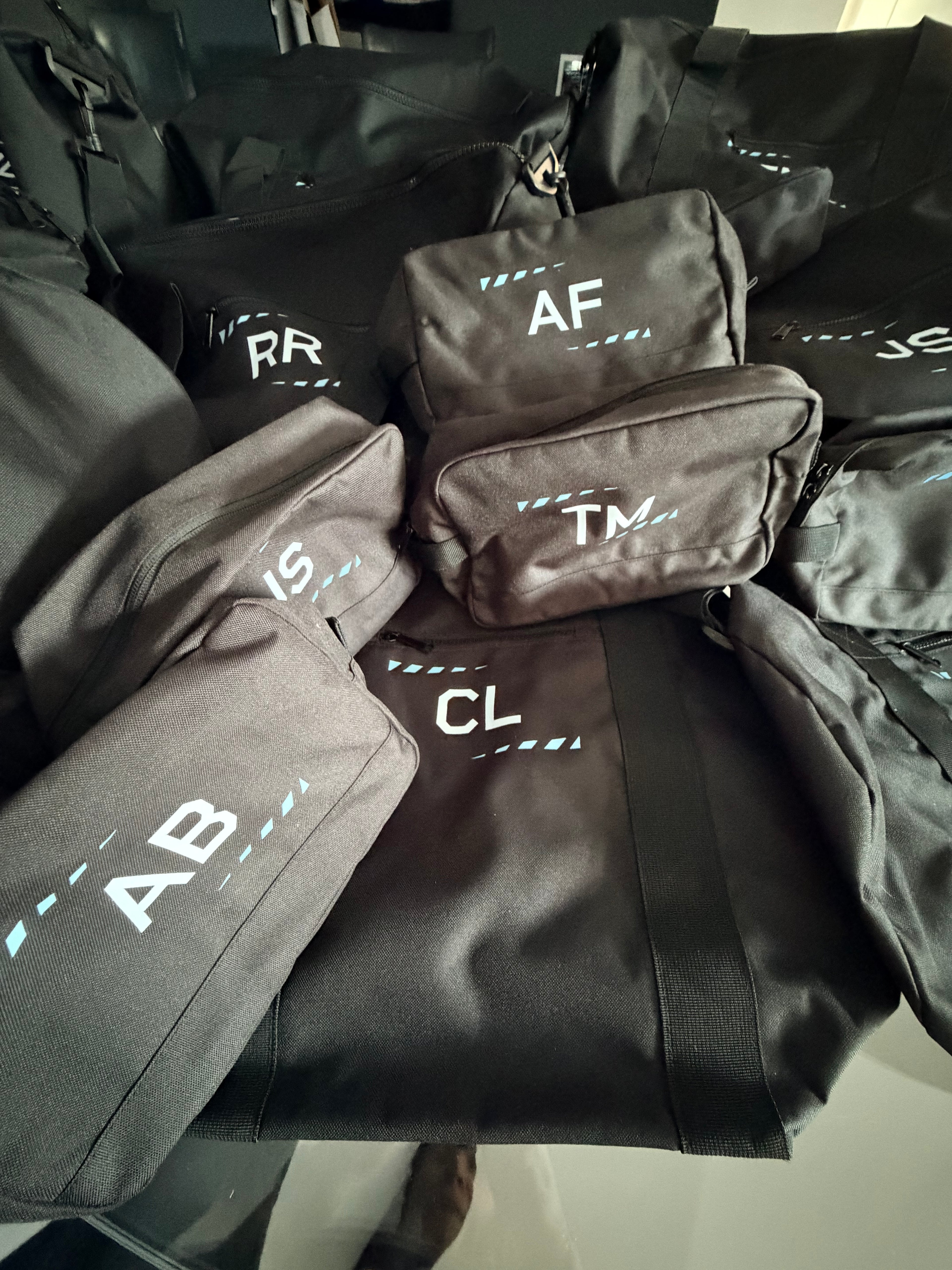 Black sports duffel bag with personalised name initials in white