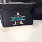 Black washbag with 'AMELIE' branding on a white surface