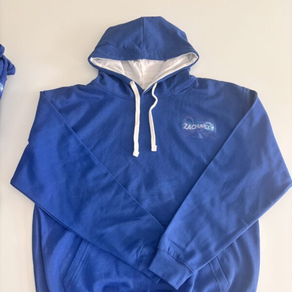 Blue hoodie with a logo on a beige background