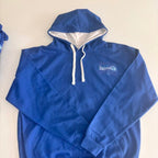 Blue hoodie with a logo on a beige background