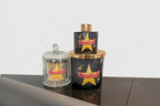 Candle, diffuser and match bottle gift set with 'Kendall' branding on a reflective surface.