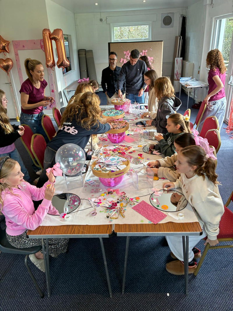 Children at a Mirrored Memories mirror party with balloons and decorations in a room