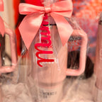 Clear stanley-style cup with pink bow and 'mum' text on a blurred background.