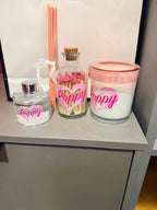 Decorative diffuser, candle and match box set with 'Poppyr' and pink lids.