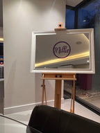 Easel with a white frame classic mirror with 'Millie' on purple acrylic.