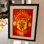 Framed speech gift of the Manchester United logo with acrylic.