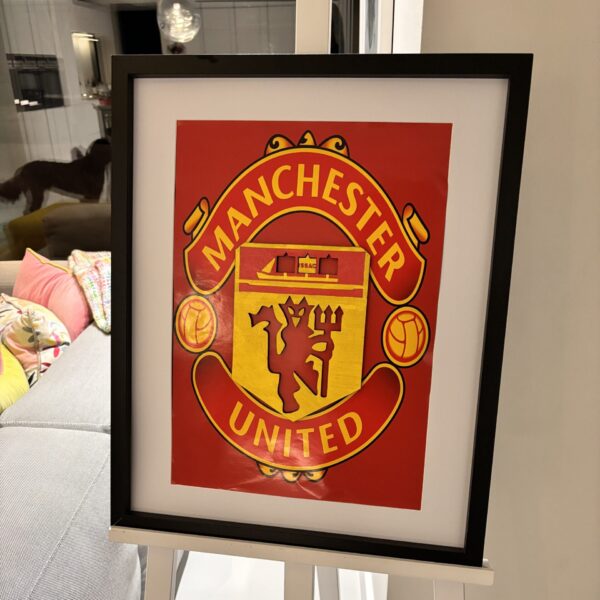 Framed speech gift of the Manchester United logo with acrylic.