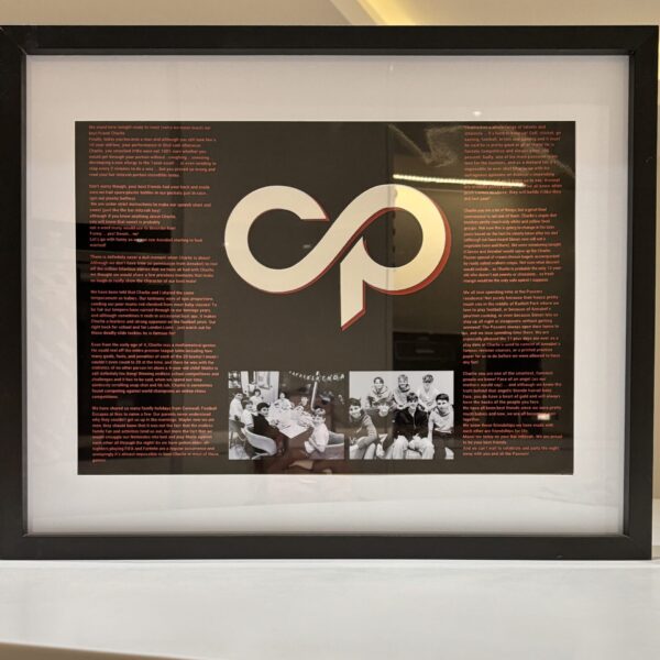 Framed speech gift with a logo and text on a black background with acrylic