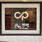 Framed speech gift with a logo and text on a black background with acrylic