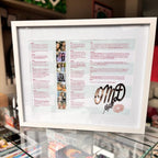 Framed speech gift with text and photos on a glass surface and acrylic.
