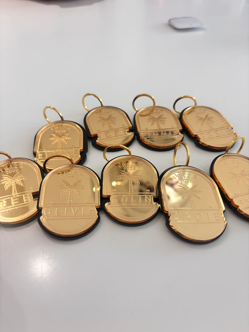 Gold-coloured coin keyrings with engravings