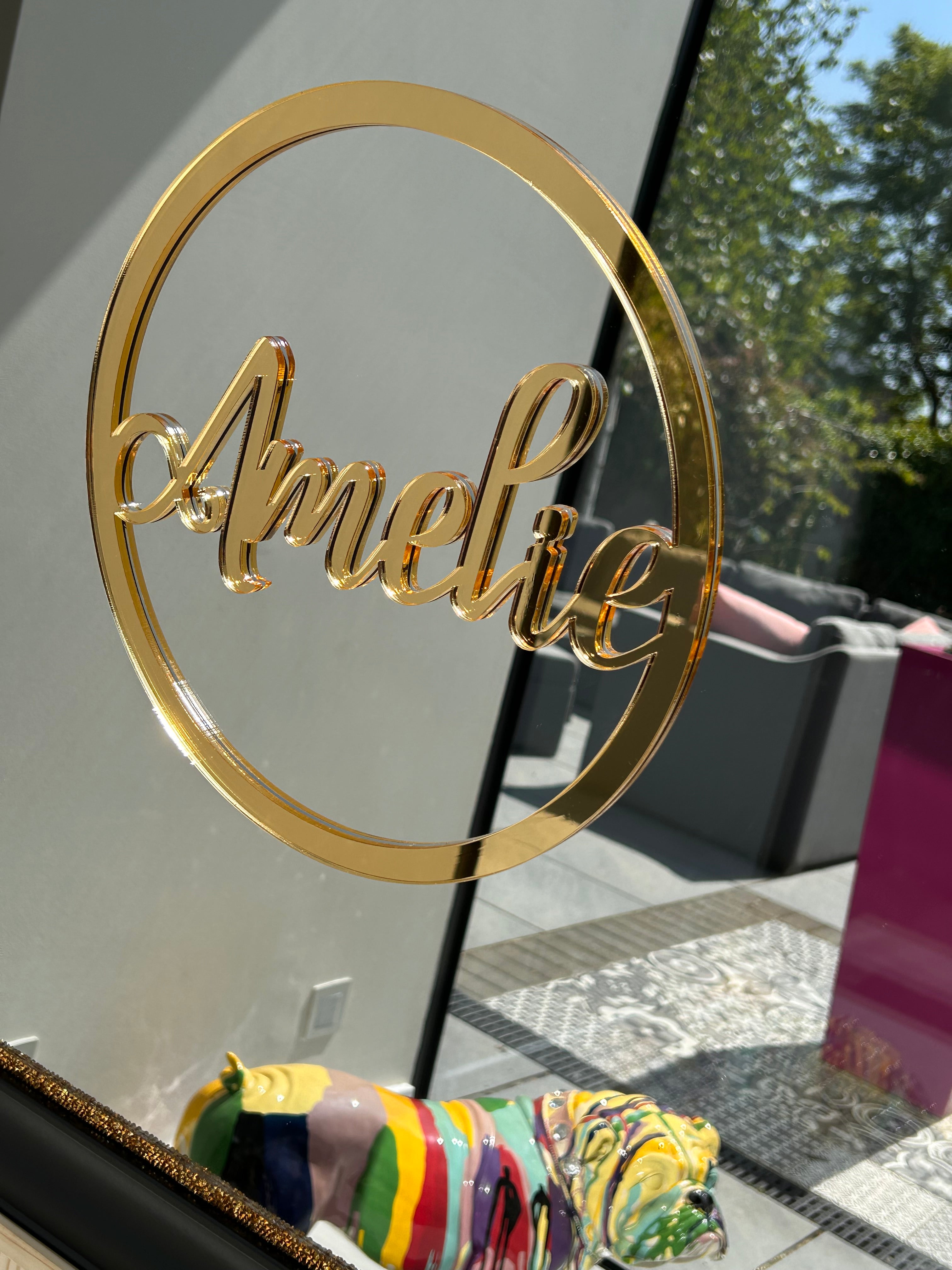 Gold acrylic name spelling 'Amelia' on a classic mirror.