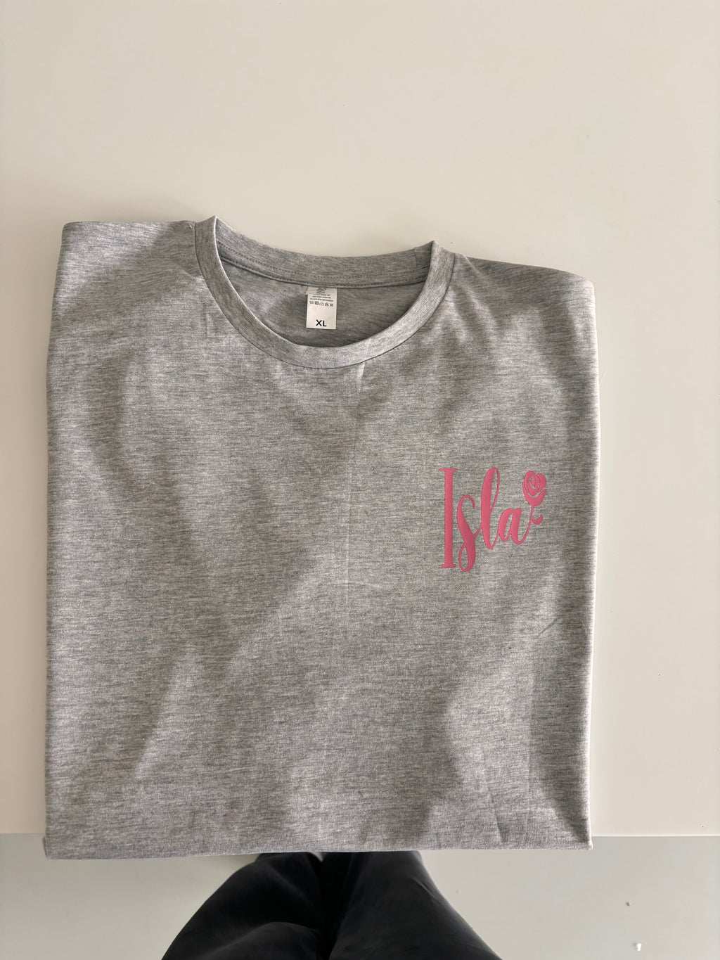 Grey event t-shirt with a red logo