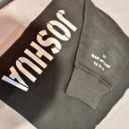 Grey sweatshirt with 'JOSEPH' printed on it, laid flat on a surface.