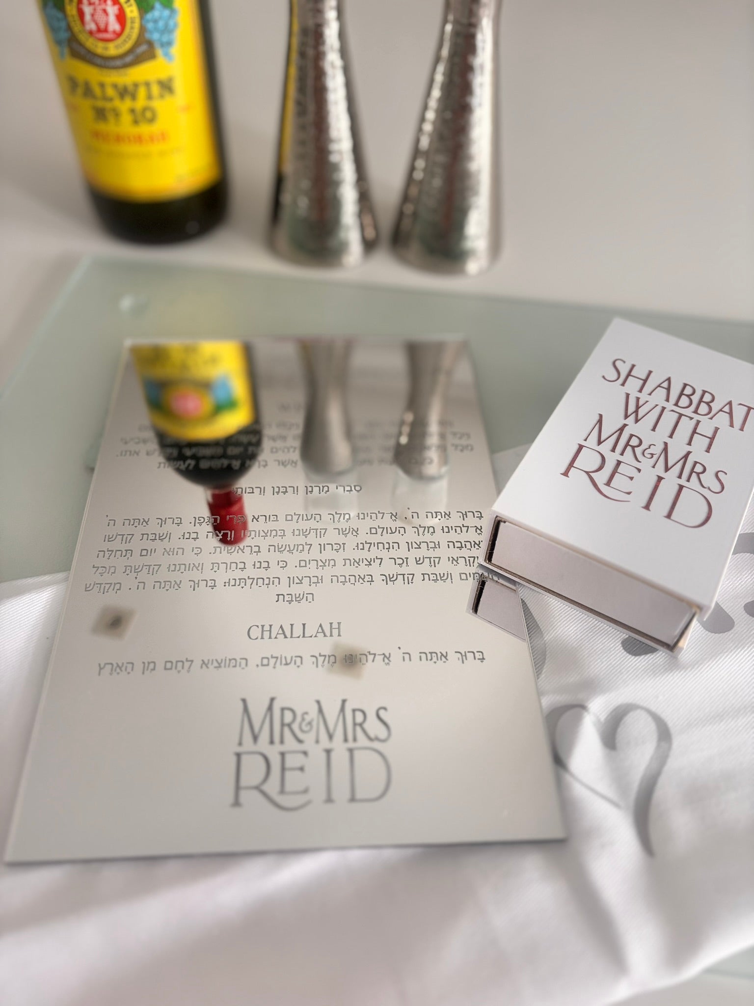 Challah board on mirrored glass with personalised prayer and Mr & Mrs Reid
