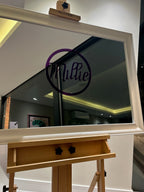 Large classic mirror on a wooden stand with 'Millie' logo in the reflection