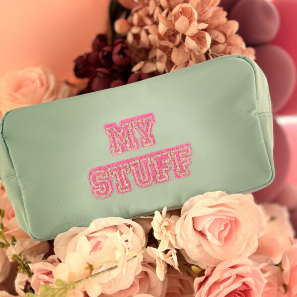 Mint choc chip washbag with 'MY STUFF' text in pink on a floral background
