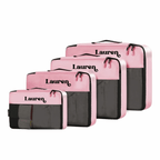 Set of pink and grey packing cubes with 'Lauren' branding on a white background