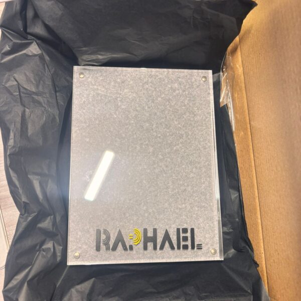 Clear acrylic photo frame with 'RA.PHAEL' branding on a black background