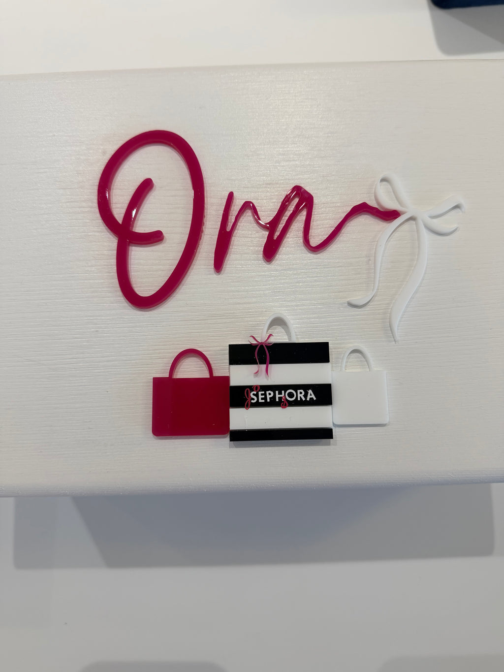 Red Sephora branded bag with 'Ora' personalised name on a white keepsake box