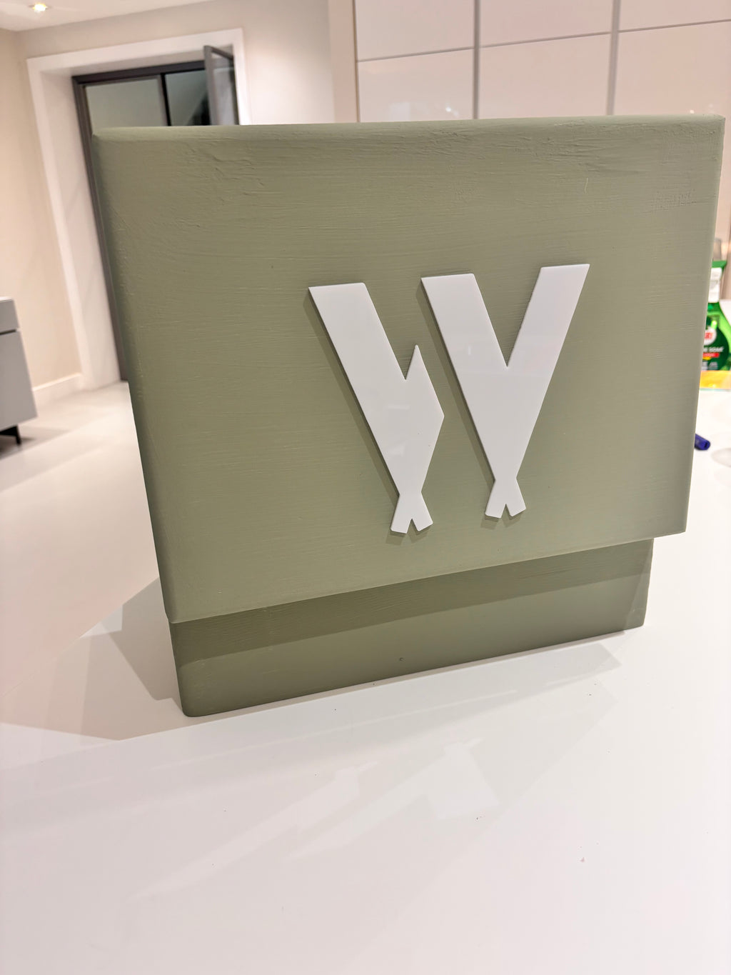 Sage keepsake box with white symbol "W" on the lid