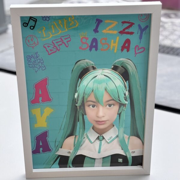 Framed speech gift of a person with green hair and colourful text on a blue background with no acrylic