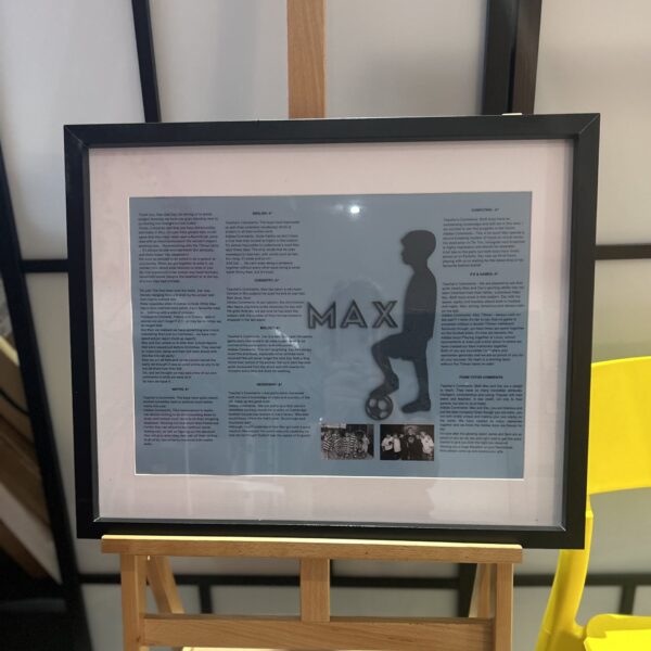 Framed speech gift with silhouette and text on a stand against a neutral background with acrylic