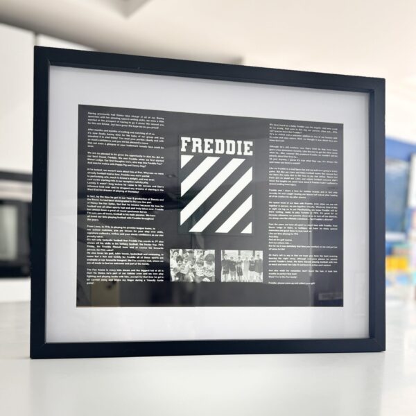 Framed speech gift with 'FREDDIE' design on a white surface with acrylic