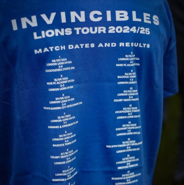 Blue t-shirt with 'Invincibles Lions Tour 2024/25' text and match dates on a dark background