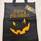 Black Halloween tote bag with pumpkin face and 'Happy Halloween' text on a white background