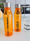 Two orange sports insulated water bottles with silver lids on a white surface, featuring 'Medik8' branding.
