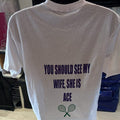 White t-shirt with personalised text and tennis racket graphics on a plain background