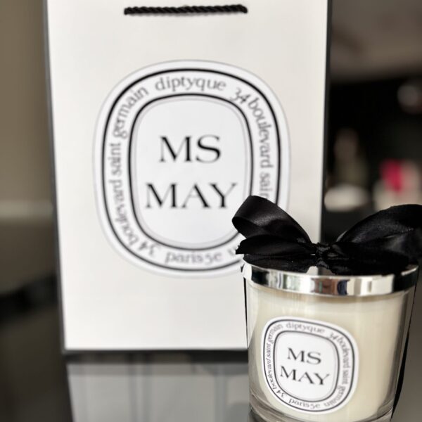 Diptyque-style 'MS May' candle with packaging in the background