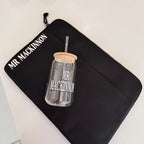 Clear cold cup on a black pouch with 'MR MACKINNON' branding on a white background.