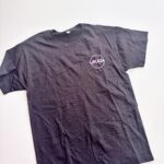 Black event t-shirt with a logo on a white background