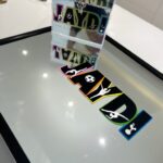 Collection of colourful 'JAYDI' branded stickers on a gift box