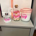Decorative diffuser, candle and match box set with 'Poppyr' and pink lids.