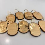 Gold-coloured coin keyrings with engravings