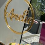 Gold acrylic name spelling 'Amelia' on a classic mirror.
