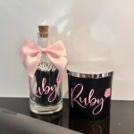 Pink and black diffuser and match bottle set with "Ruby" personalised in pink lettering.
