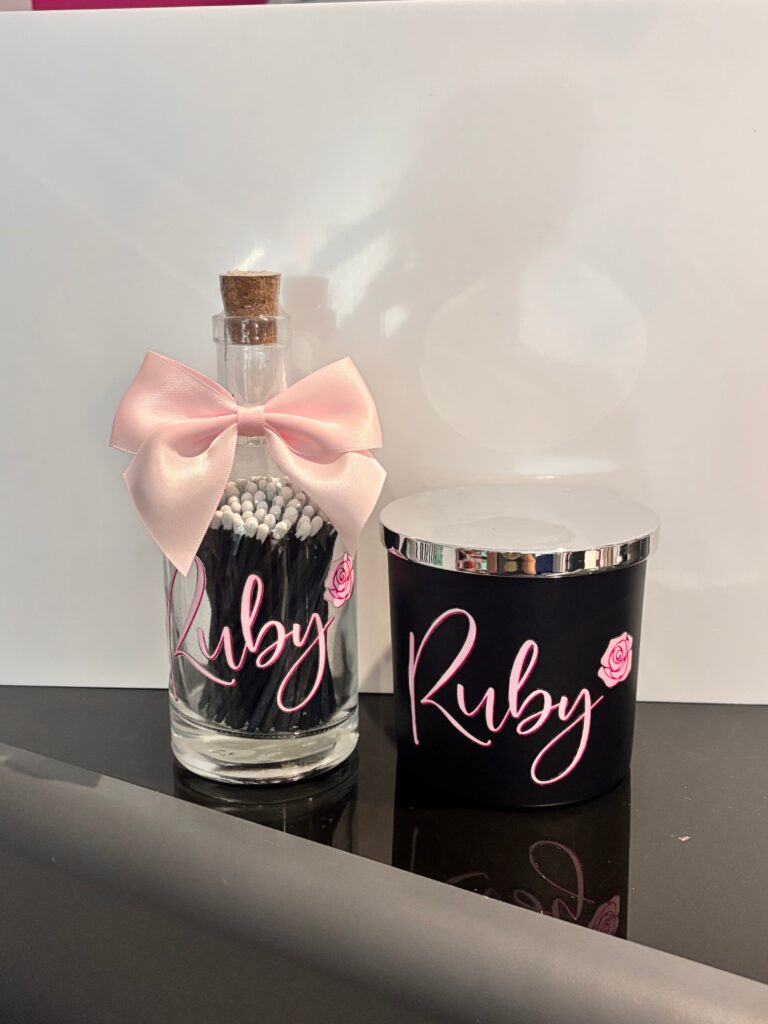 Pink and black diffuser and match bottle set with "Ruby" personalised in pink lettering.