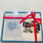 Framed speech gift with a photo of three children and a red ribbon on a white background with no acrylic.