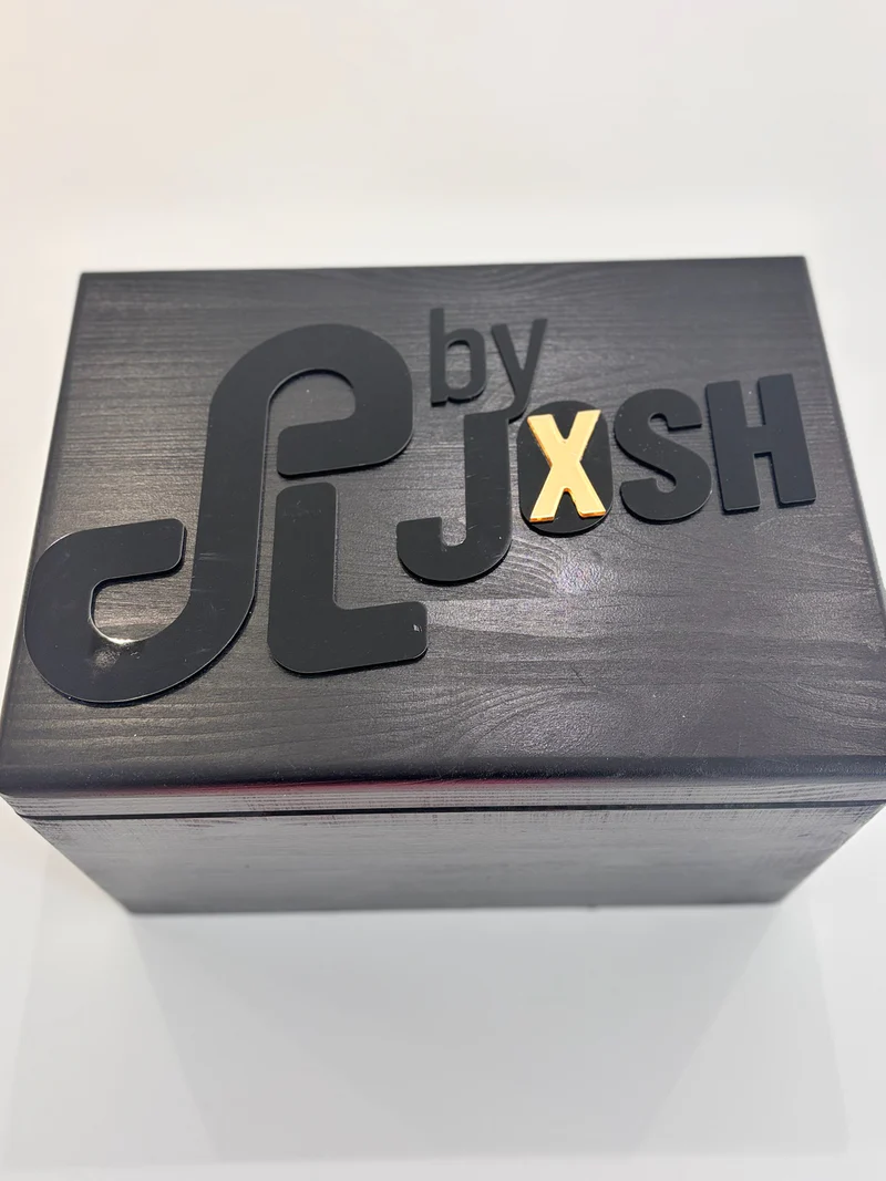 Black_keepsake_box_with_by_JXSH_branding_on_a_white_background