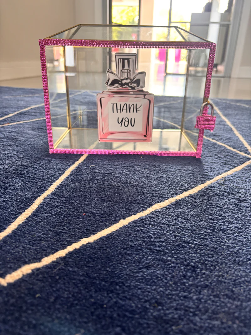 Small_perfume_bottle_design_with_THANK_YOU_text_in_a_decorative_gift_card_box_on_a_textured_surface.
