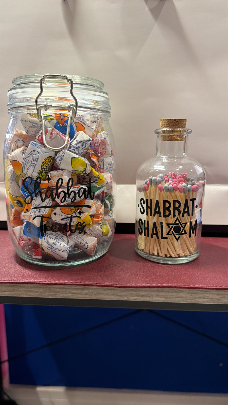 Two_glass_jars_with_decorative_items_on_a_red_surface_as_faith_gifts
